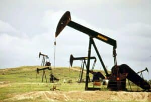 a group of oil pumps sitting on top of a field